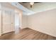 Neutral painted bedroom with gray floors and a modern ceiling fan at 1700 Bassett St # 802, Denver, CO 80202