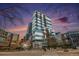 Beautiful exterior of modern high-rise condominium building with glass facade and striking architectural design at 1700 Bassett St # 802, Denver, CO 80202