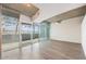 Bright living room features large windows, concrete ceilings, and wood flooring at 1700 Bassett St # 802, Denver, CO 80202