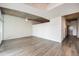 Spacious living room features concrete ceilings, wood flooring, and modern lighting at 1700 Bassett St # 802, Denver, CO 80202