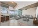 Bright living room with modern furnishings, an exposed concrete ceiling, and sliding glass doors to the outside at 1700 Bassett St # 802, Denver, CO 80202