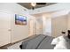 Bright bedroom with a ceiling fan, gray carpet, and neutral paint at 1700 Bassett St # 802, Denver, CO 80202