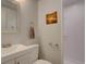 Bathroom with sink, toilet, towel rack and walk-in shower at 1641 Orchard Dr, Denver, CO 80221