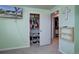 Bright bedroom featuring an organized closet with plenty of storage space and a mounted TV at 1641 Orchard Dr, Denver, CO 80221