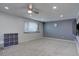 This bedroom has neutral carpet and gray walls at 1641 Orchard Dr, Denver, CO 80221