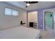 Bright bedroom featuring plush carpet, a ceiling fan, and ample closet space for convenient storage at 1641 Orchard Dr, Denver, CO 80221