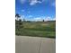 A grassy field provides space for activities in this surrounding community park at 1641 Orchard Dr, Denver, CO 80221