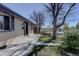 Beautiful home exterior, with a manicured lawn and walkway leading to the front door and covered entryway at 1641 Orchard Dr, Denver, CO 80221