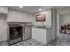 Modern laundry room with sleek washer/dryer, sink and granite countertop, and stylish patterned flooring at 1641 Orchard Dr, Denver, CO 80221