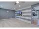 Spacious living room with gray walls and modern ceiling fan at 1641 Orchard Dr, Denver, CO 80221