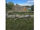 Rock sign for Sherrelwood Park is surrounded by grass and other vegetation at 1641 Orchard Dr, Denver, CO 80221