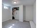 Room with neutral gray carpet, closet with built-in shelving and window at 1641 Orchard Dr, Denver, CO 80221