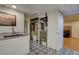 Functional utility room with granite countertop, patterned flooring and mechanical equipment at 1641 Orchard Dr, Denver, CO 80221
