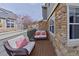 Relaxing balcony area with comfortable seating and brick accents at 14300 Waterside Ln # J4, Broomfield, CO 80023
