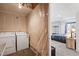 Laundry area, adjacent to a finished bedroom at 14300 Waterside Ln # J4, Broomfield, CO 80023
