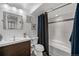 Bathroom featuring a sleek vanity, modern fixtures, and a shower-tub combination at 14300 Waterside Ln # J4, Broomfield, CO 80023