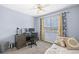 Bedroom with a daybed and workstation, complete with monitors and desk at 14300 Waterside Ln # J4, Broomfield, CO 80023