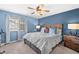 Inviting bedroom with a queen-sized bed, a ceiling fan and stylish decor at 14300 Waterside Ln # J4, Broomfield, CO 80023