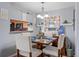 Cozy dining room with modern chandelier and decorative wall accents at 14300 Waterside Ln # J4, Broomfield, CO 80023
