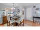 Charming dining space with a rustic table, comfortable seating, and stylish wall decor at 14300 Waterside Ln # J4, Broomfield, CO 80023