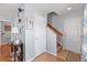 Bright entryway features hardwood floors, a staircase, and a conveniently located half bath at 14300 Waterside Ln # J4, Broomfield, CO 80023