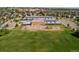 Aerial view of a school with large athletic fields and playground at 14300 Waterside Ln # J4, Broomfield, CO 80023