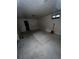 Unfinished basement space with concrete flooring and limited natural light through a small window at 888 Wolff St, Denver, CO 80204