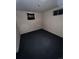 Small bedroom with basic carpeting, minimal natural light, and a simple overhead light fixture at 888 Wolff St, Denver, CO 80204