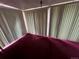 Picture of a room with vertical blinds and a crimson covered area at 888 Wolff St, Denver, CO 80204