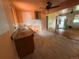 This kitchen area features ample countertop space, a ceiling fan, and an opening leading to the front of the house at 888 Wolff St, Denver, CO 80204
