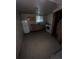 Small secondary kitchen features a white refrigerator and stove with simple wooden cabinets above the sink at 888 Wolff St, Denver, CO 80204