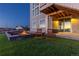Inviting backyard with a fire pit and comfortable chairs, creating a relaxing outdoor space for homeowners at 7517 Copper Sky Ct, Castle Pines, CO 80108