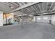 Spacious unfinished basement with high ceilings, carpet, and windows for natural light at 7517 Copper Sky Ct, Castle Pines, CO 80108