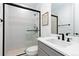 Modern bathroom featuring glass shower, sleek vanity, and contemporary fixtures at 7517 Copper Sky Ct, Castle Pines, CO 80108