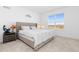 Cozy bedroom with plush bedding, soft carpet, and a picturesque window view at 7517 Copper Sky Ct, Castle Pines, CO 80108