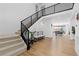Welcoming foyer with modern staircase, bench seating and open layout at 7517 Copper Sky Ct, Castle Pines, CO 80108