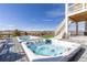 Dual hot tubs on a deck with scenic views, ideal for outdoor enjoyment and relaxation at 7517 Copper Sky Ct, Castle Pines, CO 80108
