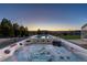 Luxurious hot tubs surrounded by lush landscaping, perfect for relaxation under the stars at 7517 Copper Sky Ct, Castle Pines, CO 80108