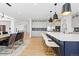 Well-designed kitchen featuring an island, modern appliances, and open layout to dining and living spaces at 7517 Copper Sky Ct, Castle Pines, CO 80108