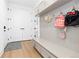 Functional mudroom with built-in bench, storage, and convenient hooks for organization at 7517 Copper Sky Ct, Castle Pines, CO 80108
