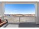 Inviting porch with a comfortable swing and stunning views of the surrounding landscape at 7517 Copper Sky Ct, Castle Pines, CO 80108