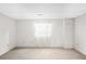 Spacious room with carpet, a window with sheer curtains, and neutral-painted walls at 11945 W 66Th Pl # A, Arvada, CO 80004