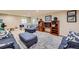 Spacious basement living area with plush seating, an entertainment center, and a play area with natural light at 2872 Dreamcatcher Loop, Castle Rock, CO 80109