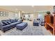Basement living area with comfortable seating, playroom, and access to storage, featuring a neutral color palette at 2872 Dreamcatcher Loop, Castle Rock, CO 80109