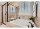 Relaxing soaking tub and tiled shower stall create a spa-like experience in the bathroom at 2872 Dreamcatcher Loop, Castle Rock, CO 80109
