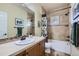 Well-lit bathroom featuring a single vanity with plenty of counter space and tile at 2872 Dreamcatcher Loop, Castle Rock, CO 80109