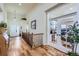 Welcoming foyer with hardwood floors, a staircase, and a view into a bright home office at 2872 Dreamcatcher Loop, Castle Rock, CO 80109