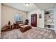 Cozy living room with comfortable seating, built-in shelving, and natural light at 2872 Dreamcatcher Loop, Castle Rock, CO 80109
