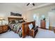 Spacious main bedroom showcasing a comfortable bed and scenic mountain artwork at 2872 Dreamcatcher Loop, Castle Rock, CO 80109