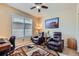 Inviting office with leather recliners, natural light, and nature-themed decor at 2872 Dreamcatcher Loop, Castle Rock, CO 80109